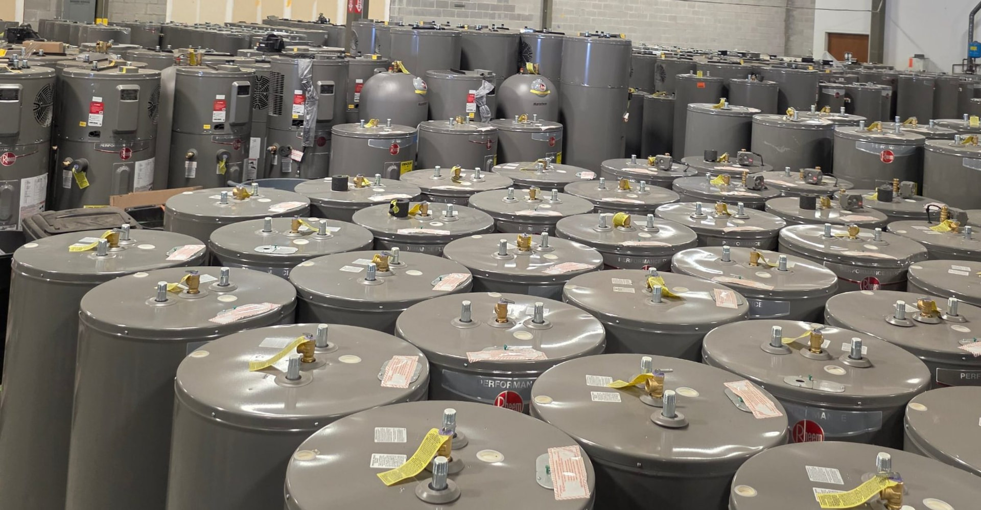 Rows of new water heaters ready to install